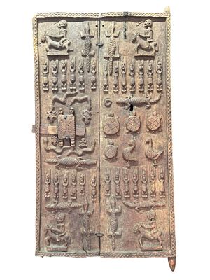 AFRICAN CARVED WOODEN DOOR WITH CARVED LATCH, POSSIBLY YORUBA, NIGERIA. 20TH CENTURY, . FROM 