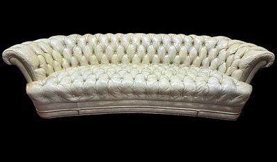 VINTAGE ORIGINAL CURVED CHESTERFIELD SOFA. A GENEROUSLY PROPORTIONED SOFA FEATURING GENTLY 