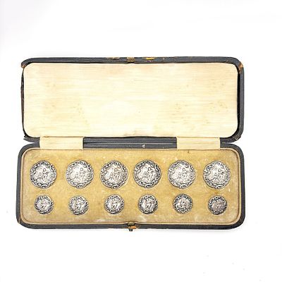 Three boxed sets Antique Sterling Silver Buttons. The first set of twelve buttons made by Levi & 