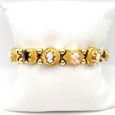 14K Gold Cameo Slide Bracelet. 14K Yellow gold slide bracelet with each slide having a carved 