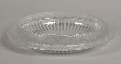 A Lalique Glass Centerpiece 
A partially frosted glass centerpiece in the 