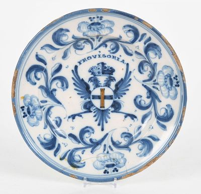 An 18th Century Talavera Blue and White Plate 
The decoration centered by a crowned 