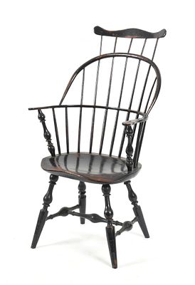American Black-Painted Sack and Comb-Back Armchair, Circa 1800. An American Black-Painted Sack 