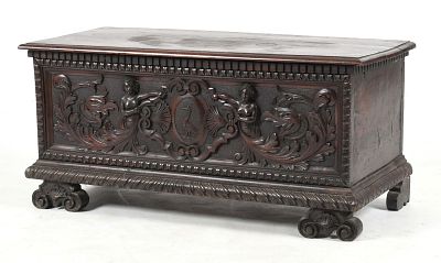 An Italian Renaissance Revival Carved Chest, 19th Century 
The two board top above a 