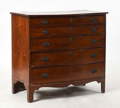 A Federal Mahogany Bowfront Chest of Drawers, New England, c. 1800 
With five graduated 