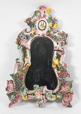 A Continental Rococo-Style Glazed Terracotta Frame, Late 19th Century 
In four sections; 