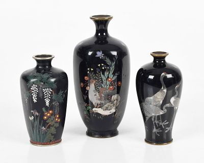Three Miniature Cloisonne Vases 
Meiji period, each with a dark blue ground, 
