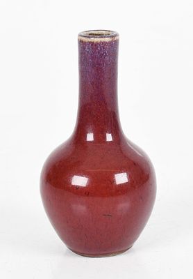 A Small Chinese Flambe Glazed Porcelain Vase 
A bottle form example, Qing 