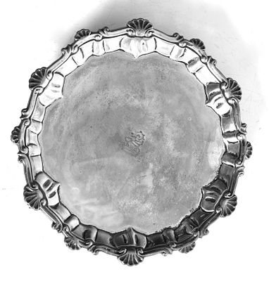 A George III Silver Salver, Mark of Ebenezer Coker, London, 1763 
With shaped shell and scroll 