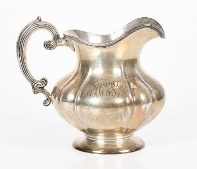 A Sterling Silver Water Pitcher by the Frank W Smith Company 
Early 20th century, with a lobed 
