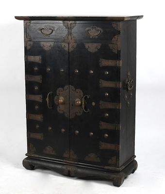 A Korean Ebonized and Brass-Mounted Cabinet, 20th Century 
With two short drawers 