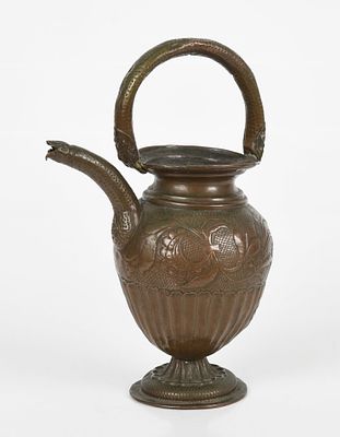 A Repousse Copper Wine Ewer 
19th century or earlier, with foliate and floral 