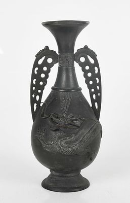 An Archaistic Japanese Bronze Vase 
20th century, a patinated bronze baluster 