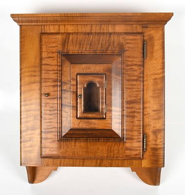 A Figured Maple Hanging Cabinet, McGuire Family, Vermont, 1993 
The door with inset watch 