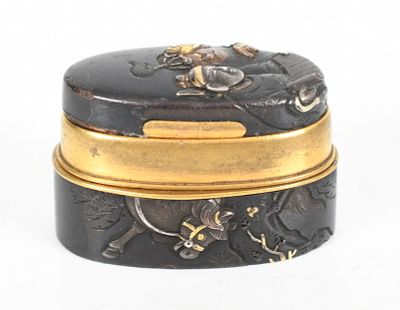 A Japanese Mixed Metal Fuchi and Kashira Converted to a Box 
Meiji period, parcel gilt 