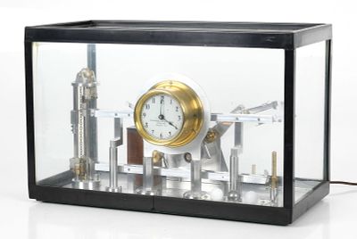 A 20th Century 'Rolling Ball' Clock 
A three ball example mounted with an International 