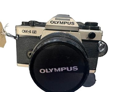 Olympus OM4 ti 35mm SLR Camera 50mm f1.8 lens. 35mm SLR camera silver, body , shutter works 