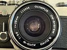 Olympus OM1 35mm SLR Camera 28mm f3.5 lens. 35mm SLR camera silver, body , shutter works Image - 1