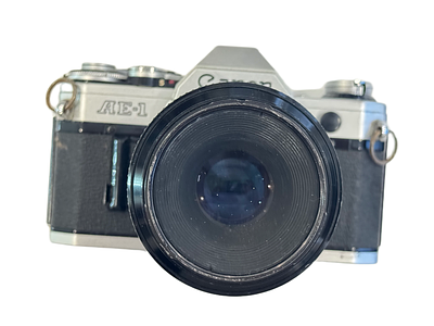 A Canon AE-1 35mm SLR Camera. body G-VG, shutter works, meter responds to light, viewfinder 