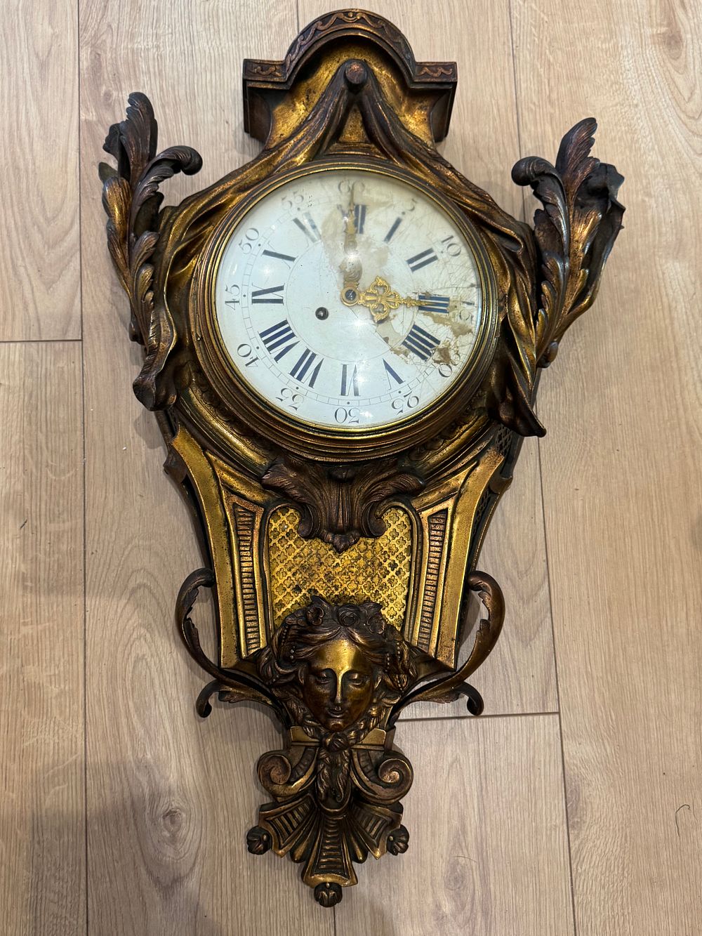 Lot 185: Louis XVI style gilt-bronze cartel clock