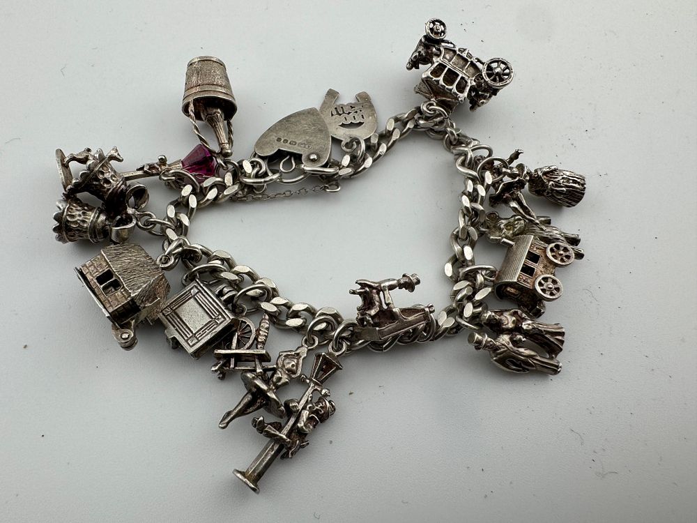 Lot 203: Sterling Silver Charm Bracelet