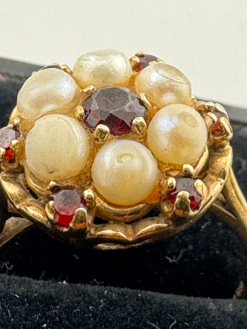 Lot 207: 9 CT GARNET AND PEARL RING