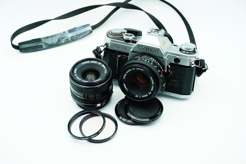 Lot 63: Canon AE-1 / Canon FD 50mm 1.8 / Canon FD 28mm 2.8