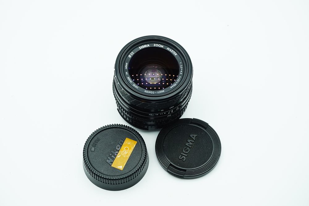 Lot 90: Sigma Zoom Master 35-70mm f/3.5-4.5 Multi-Coated Manual Focus Lens for Nikon F