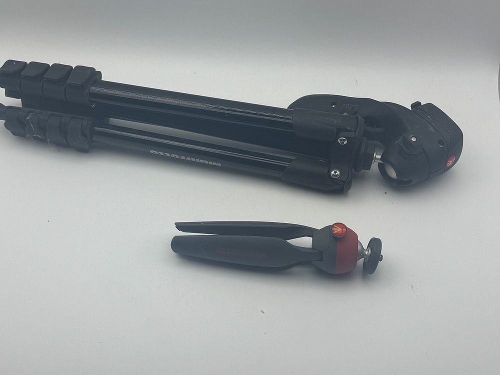 Lot 100: A 2 x manfrotto tripod
