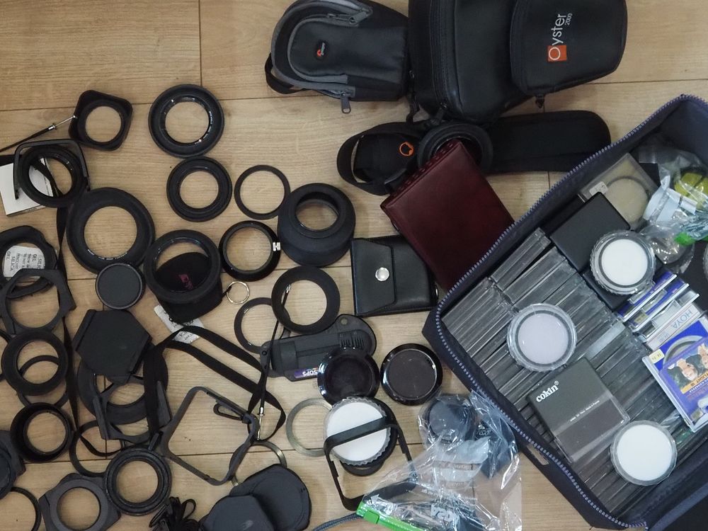 Lot 99a: Camera Filter Bundle – Cokin System, Hoya Filters, Lens Hoods, Step Rings, Cases & More