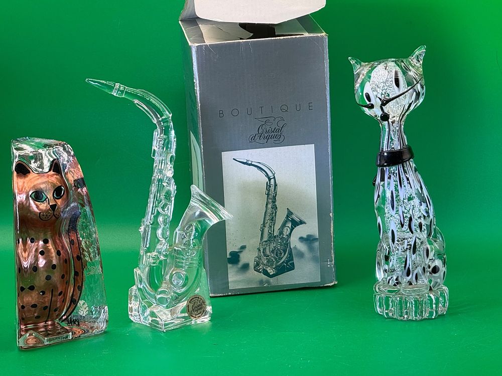 Lot 275: Three Art Glass Cat Figures and Cristal d'Arques Saxophone Ornament Collection