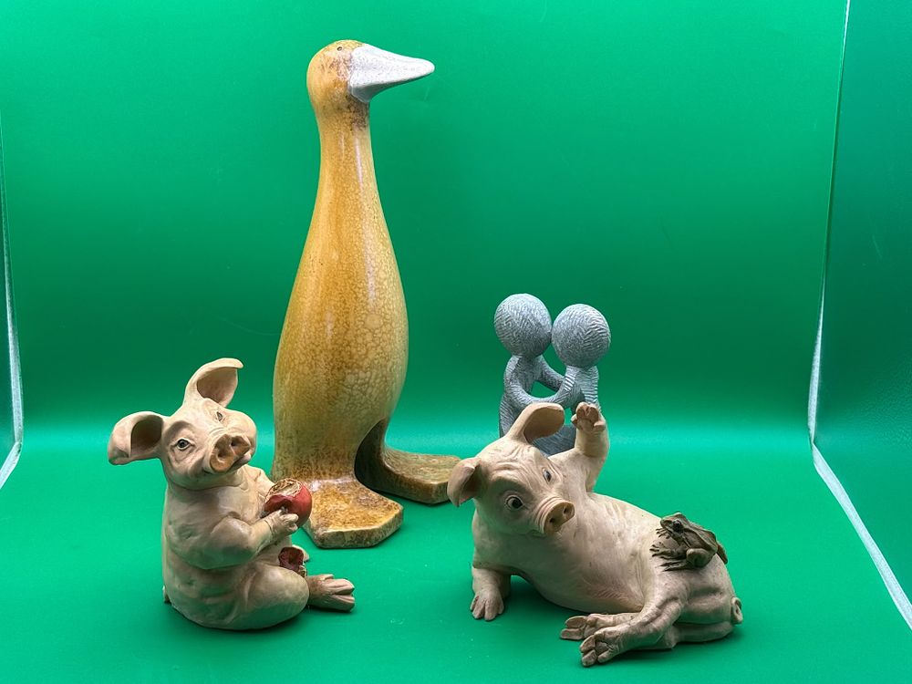 Lot 284: Collection of Four Decorative Ornaments Ducks Pigs and Embracing Couple