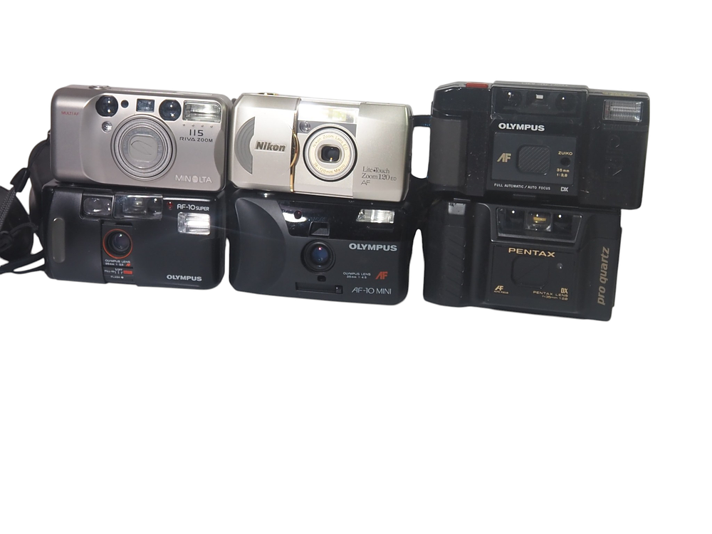 Lot 166: Six Vintage 35mm Compact Cameras Minolta Nikon Olympus Pentax
