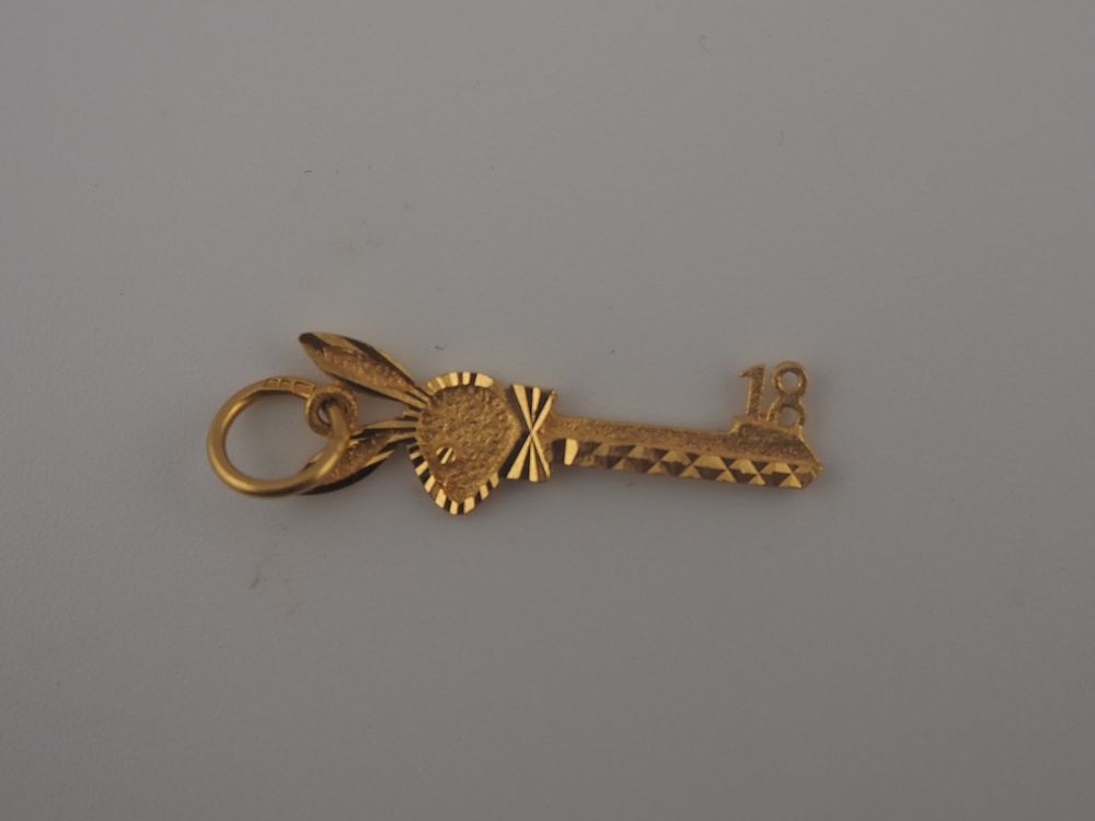 Lot 331: 22ct Gold 18th Birthday Key Pendant 2.05g