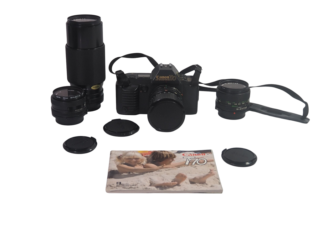 Lot 11: Canon T70 SLR Camera with Three FD Lenses, Flash , Manual and Accessories