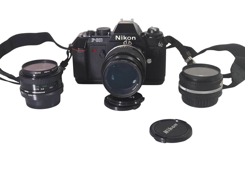 Lot 14: Nikon F301 SLR Camera With Nikkor 105mm f25 Nikkor 50mm f1.8 And Vivitar 28mm f2.8 Lenses