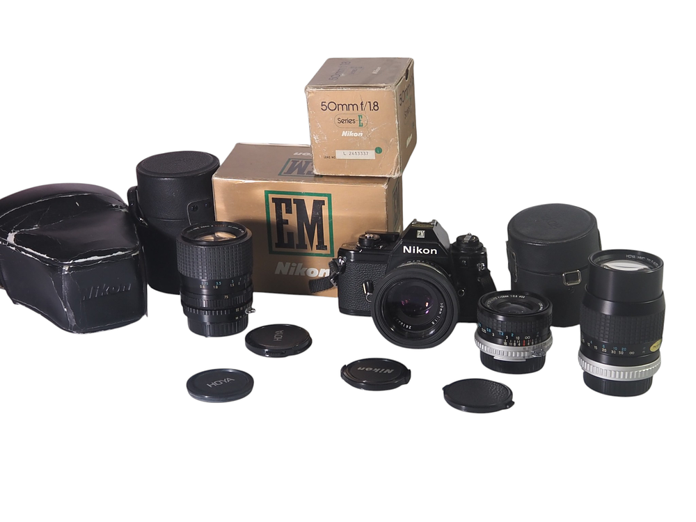 Lot 15: Nikon EM SLR Camera With Nikon Series E 50mm f1.8 And Three Hoya Lenses