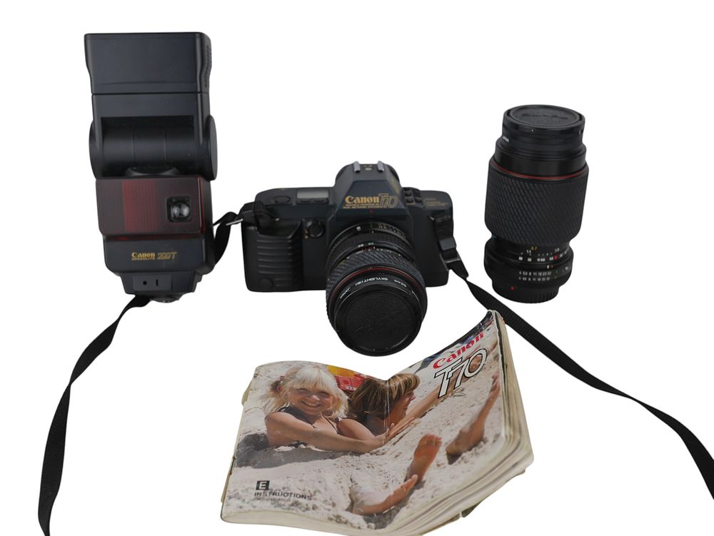 Lot 52: Canon T70 Film Camera with Tokina Lenses Flash and Case