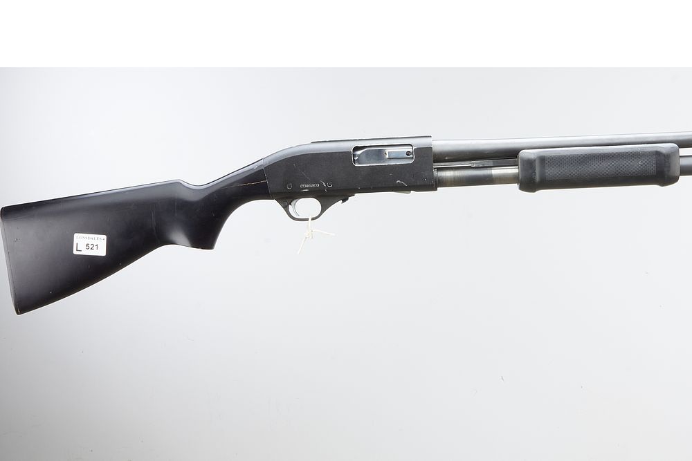 Lot 521: A 12 bore Commando pump action shotgun. Serial...