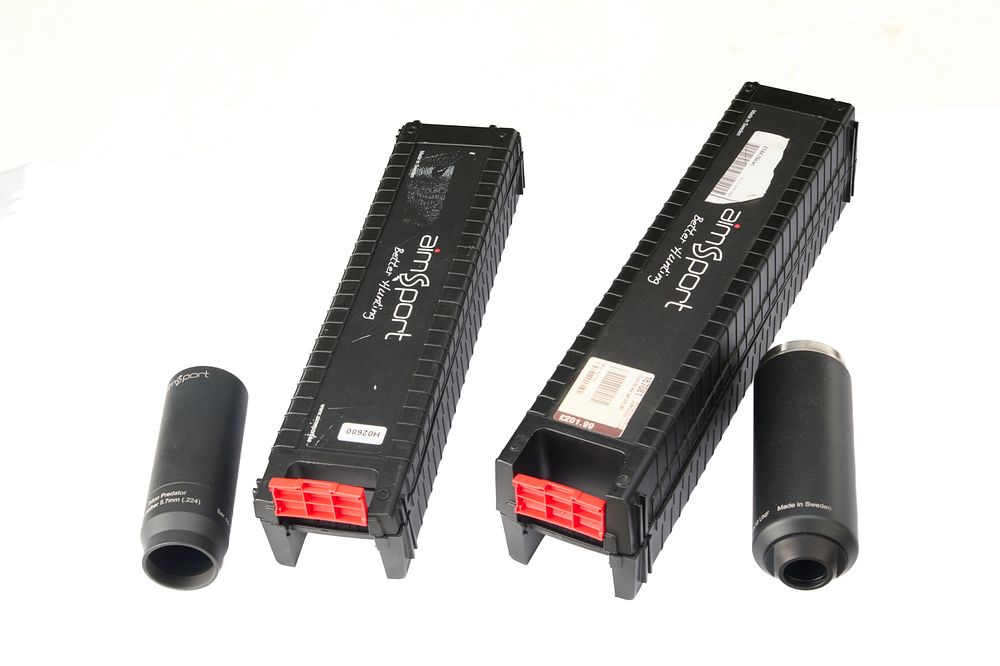 Lot 531: TWO INCOMPLETE AIM SPORT SOUND MODERATORS. A .233 TRITON PREDATOR FRONT TOGETHER WITH A TRITON 56II REAR PART 518 X 18 UNF. NEW IN BOX.