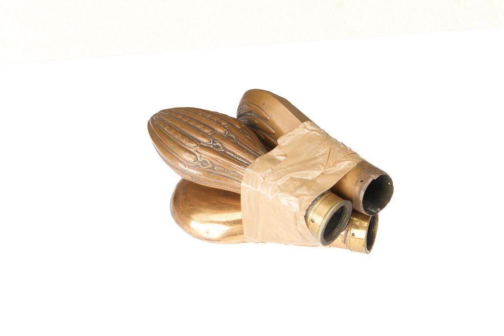 Lot 527: THREE COPPER AND BRASS POWDER FLASK BODIES. ONE PLAIN, TWO FLUTED. TOPS MISSING. GRADE 2.