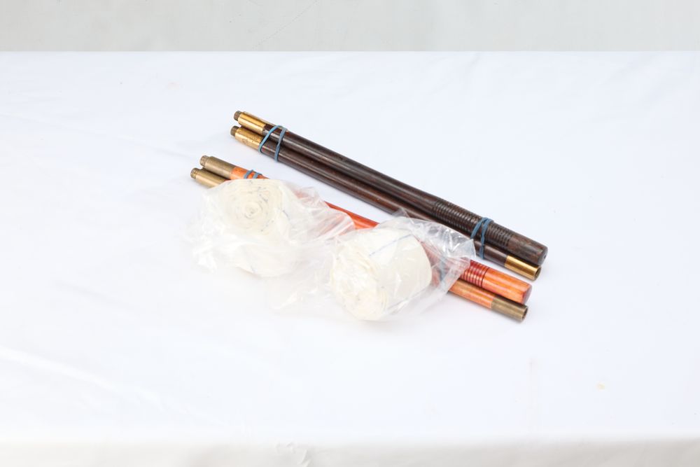 Lot 1259: 2 12 BORE CLEANING RODS W/ SWABS