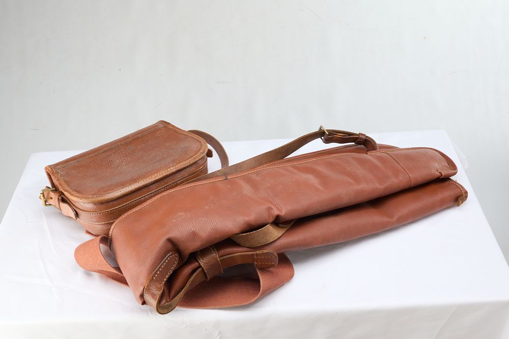 Lot 1103: A LEATHER GUNSLIP AND CARTRIDGE BAG BY BRADY. BOTH HAVE GCH INSCRIBED ON THEM.