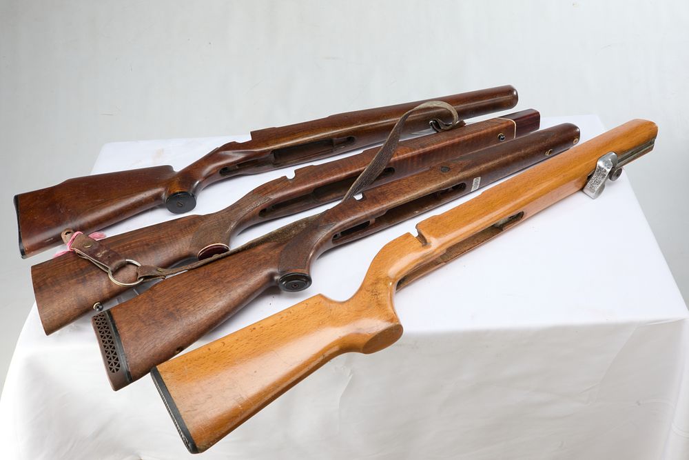 Lot 1102: A BAG OF FOUR ASSORTED RIFLE STOCKS.