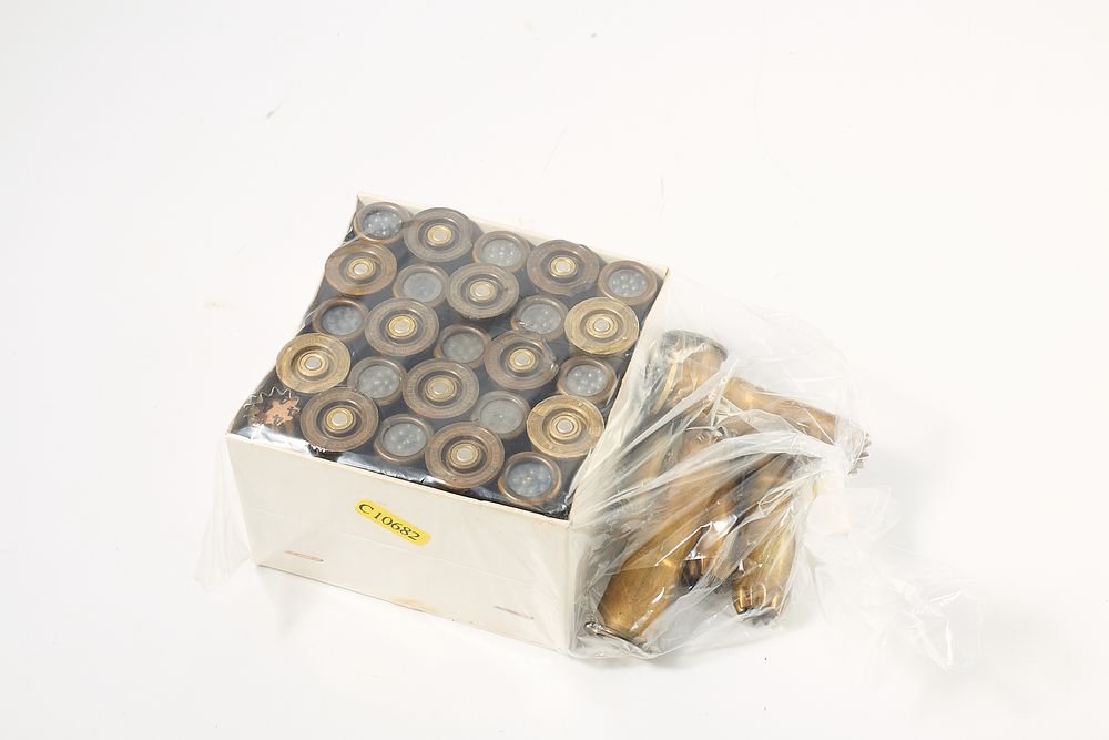 Lot 802: 30 rds of Greener Police Gun MK III, 24 rds of the plastic cased U.S.A. made cartridges, and 6 of the British brass cased variety.
