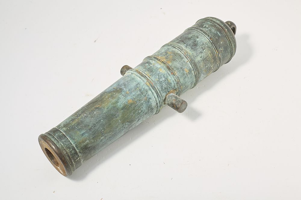 Lot 1301: 1" PATINATED BRONZE SIGNAL CANNON BARREL

 Stamped 'CM'