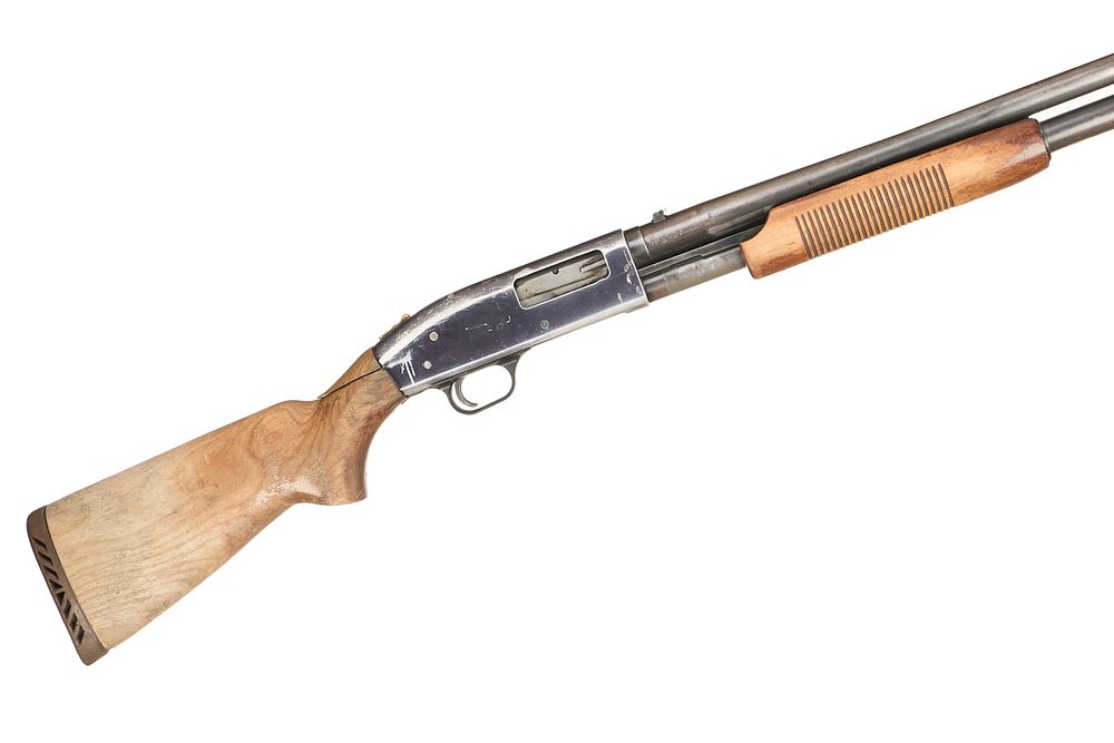 Lot 313: MOSSBERG A 12-BORE PUMP ACTION Ser No 6063