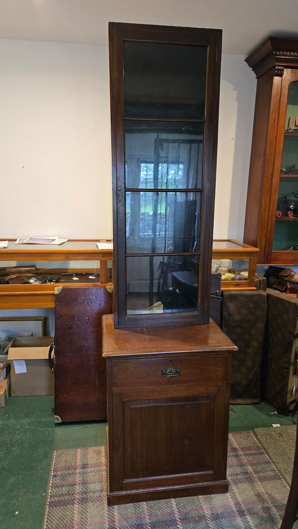Lot 82: A GLASS FRONTED CABINET