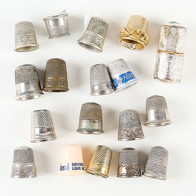 Group Assorted Vintage Thimbles. Group of assorted silver-toned vintage thimbles and one needle