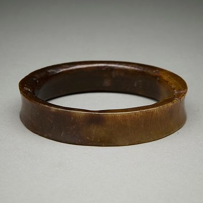 Chinese Carved Brown Jade Bangle. Chinese carved and polished brown jade bangle or bracelet 